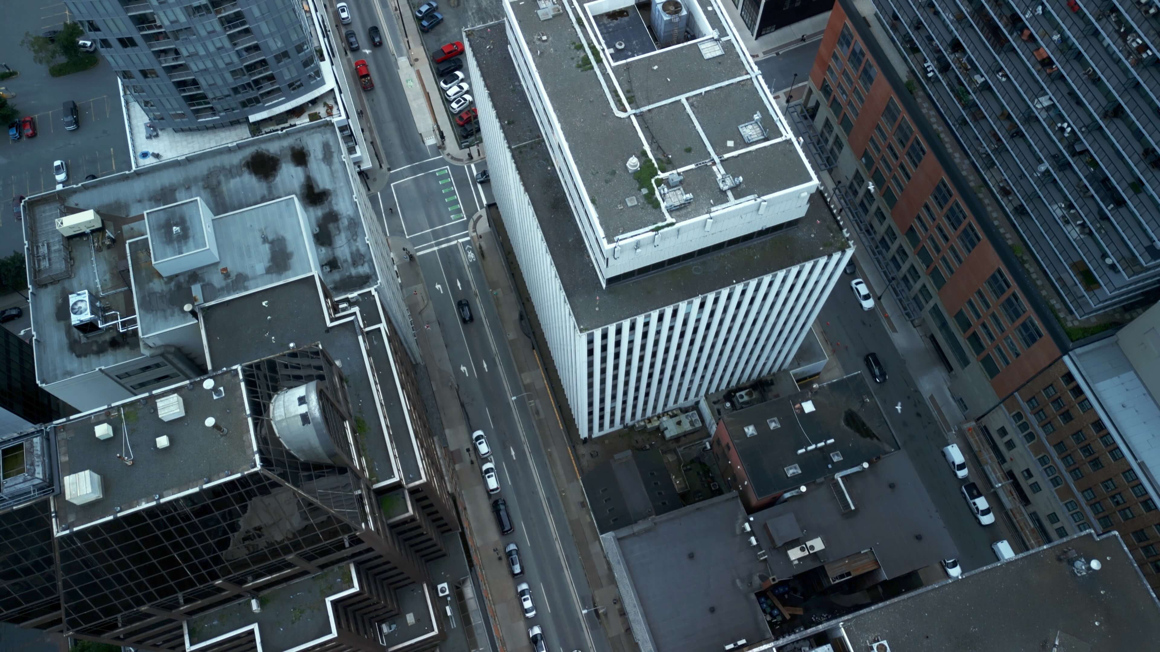 Aerial view of downtown Halifax featuring a Canadian flag, ideal for showcasing professional video production services in Halifax. Halifax videographer available for corporate, promotional, and event filming.